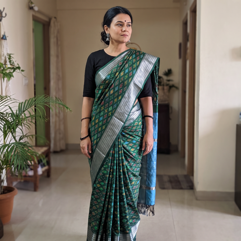 Green Traditional Pochampally Ikat Handwoven Pure Silk Pattu Saree with Rudraksha Border, draped and worn by a woman, AI visual of the saree, iTokri