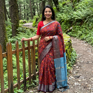 Red Traditional Pochampally Ikat Handwoven Pure Silk Pattu Saree with Rudraksha Border, draped and worn by a woman, AI visual of the saree, iTokri