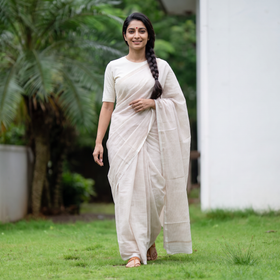 White Traditional Venkatagiri Handloom Cotton Zari Checks Saree, draped and worn by a woman, AI visual of the saree, iTokri