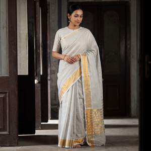 Grey Traditional Venkatagiri Handloom Cotton Zari Checks Saree with One Side Zari Border, draped and worn by a woman, AI visual of the saree, iTokri