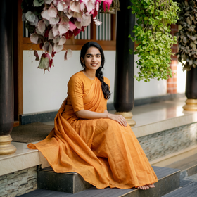 Orange Traditional Venkatagiri Handloom Cotton Zari Saree, draped and worn by a woman, AI visual of the saree, iTokri