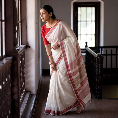 White Traditional Vidarbha Tussar Silk Handloom Saree with Woven Border, draped and worn by a woman, AI visual of the saree, iTokri