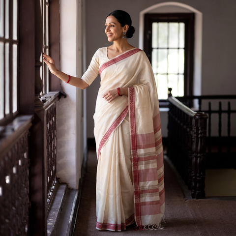 White Traditional Vidarbha Tussar Silk Handloom Saree with Woven Border, draped and worn by a woman, AI visual of the saree, iTokri