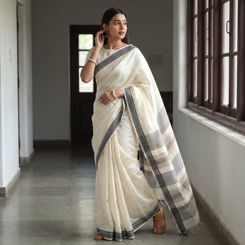 White Traditional Vidarbha Tussar Silk Handloom Saree with Woven Border, draped and worn by a woman, AI visual of the saree, iTokri