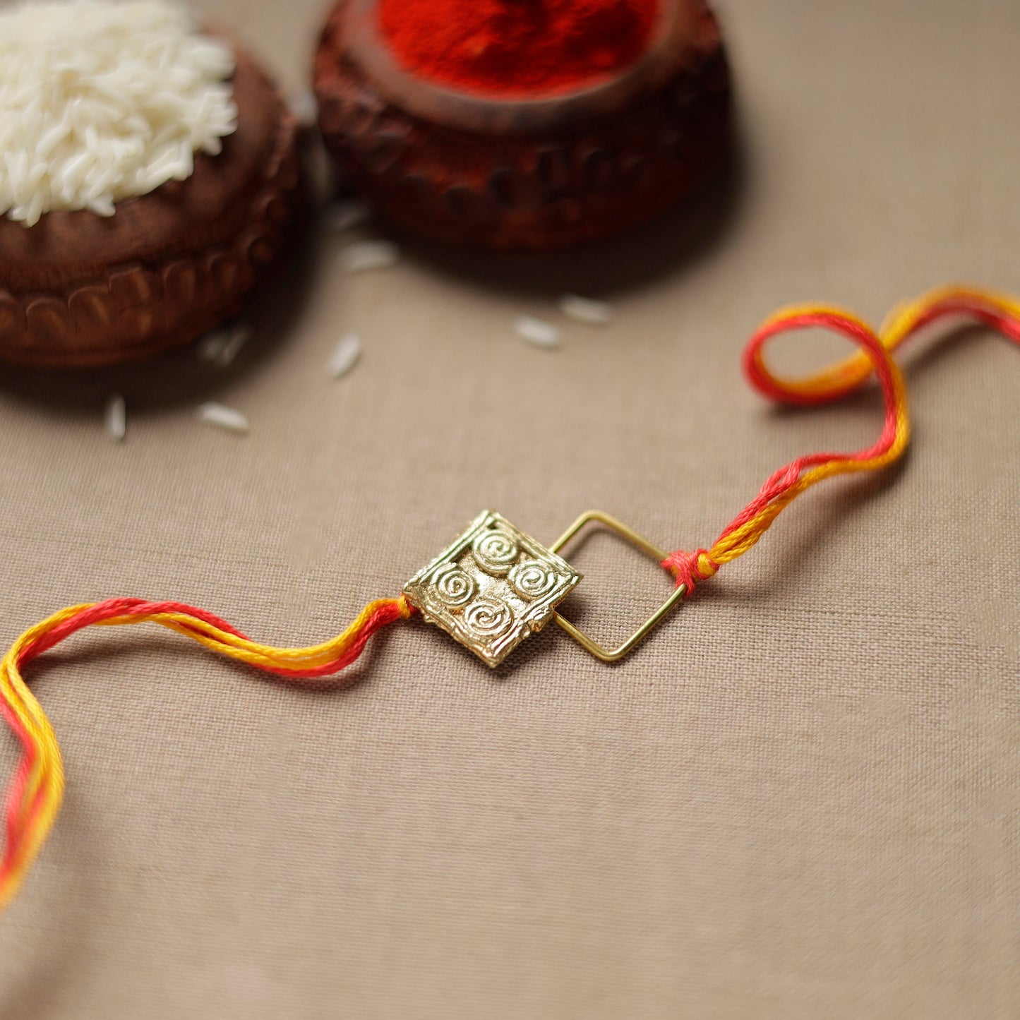  Tribal Dokra Craft Reusable Brass Rakhi by Miharu 23 