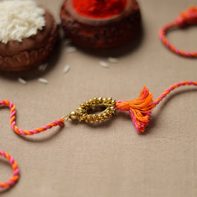 Tribal Dokra Craft Brass Rakhi by Miharu 31 