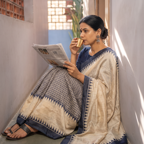 Beige Tussar Silk Pure Handloom Saree in Bengal Hand Block Prints, draped and worn by a woman, AI visual of the saree, iTokri