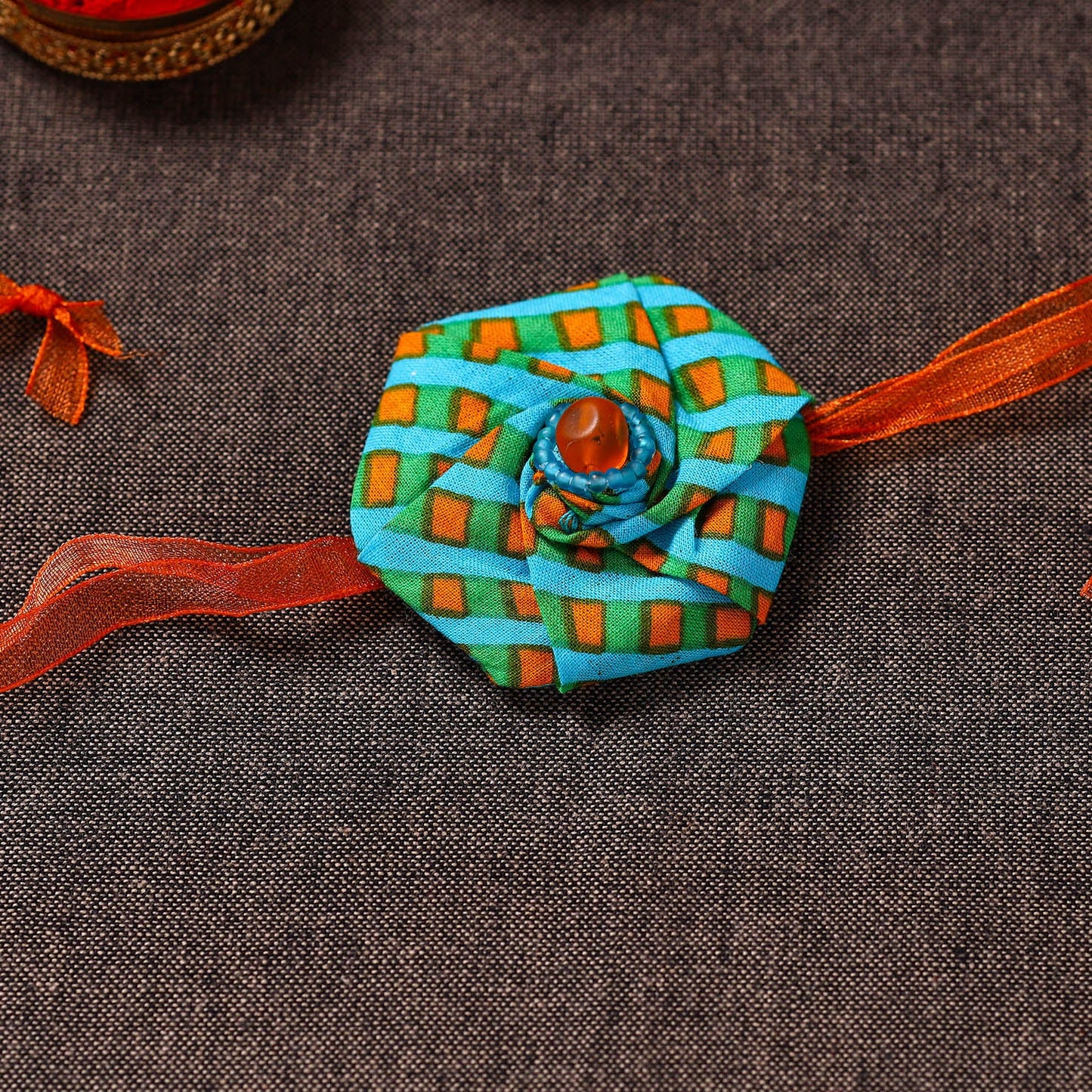  Twisted Rose - Handmade Blue Mango Rakhi 