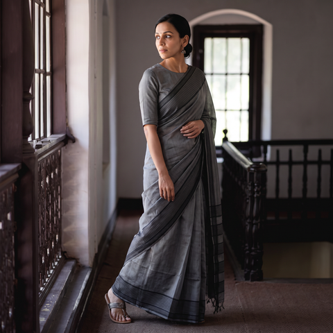 Grey Vidarbha Bamboo Tussar Cotton Dobby Border Handloom Saree, draped and worn by a woman, AI visual of the saree, iTokri