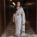 Purple and white hand block print merino wool Sanganeri saree, draped and worn by a woman, AI visual of the saree, iTokri