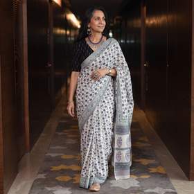 Purple and white hand block print merino wool Sanganeri saree, draped and worn by a woman, AI visual of the saree, iTokri