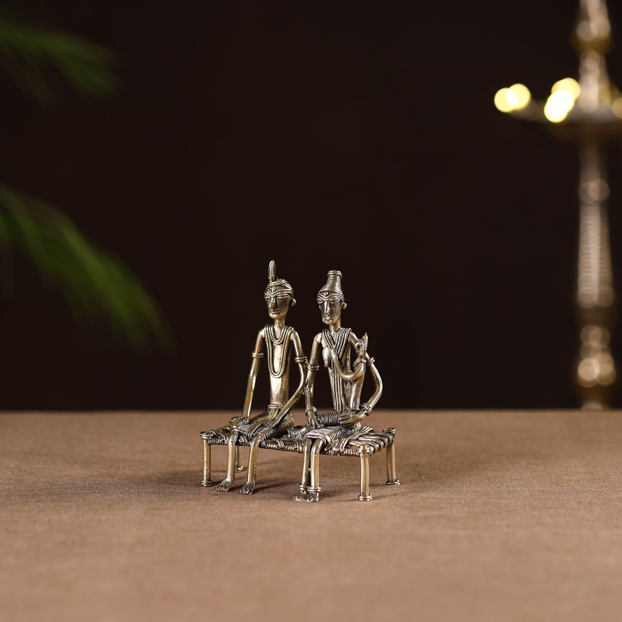 Couple child on cot - tribal odisha dokra handmade home