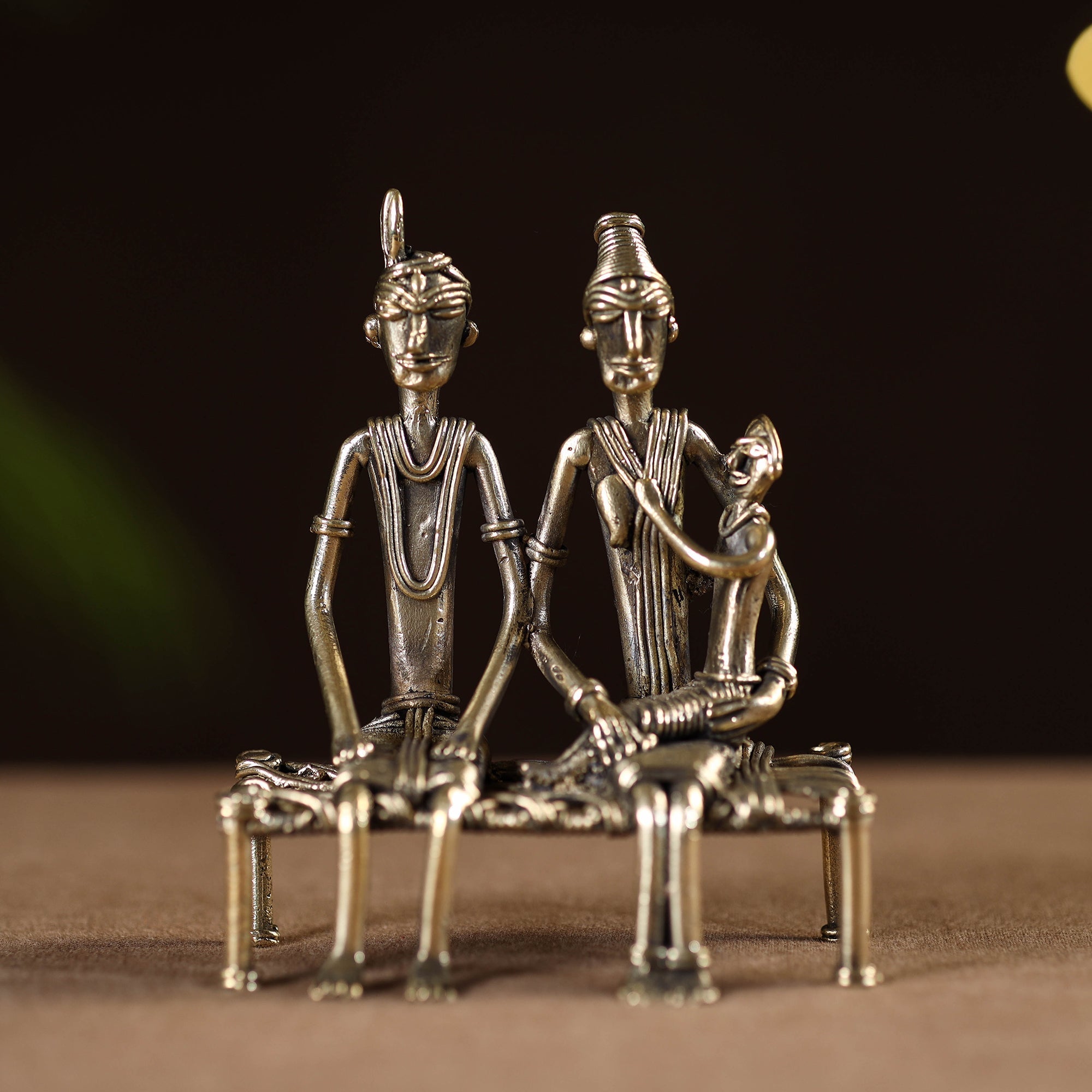 Couple child on cot - tribal odisha dokra handmade home