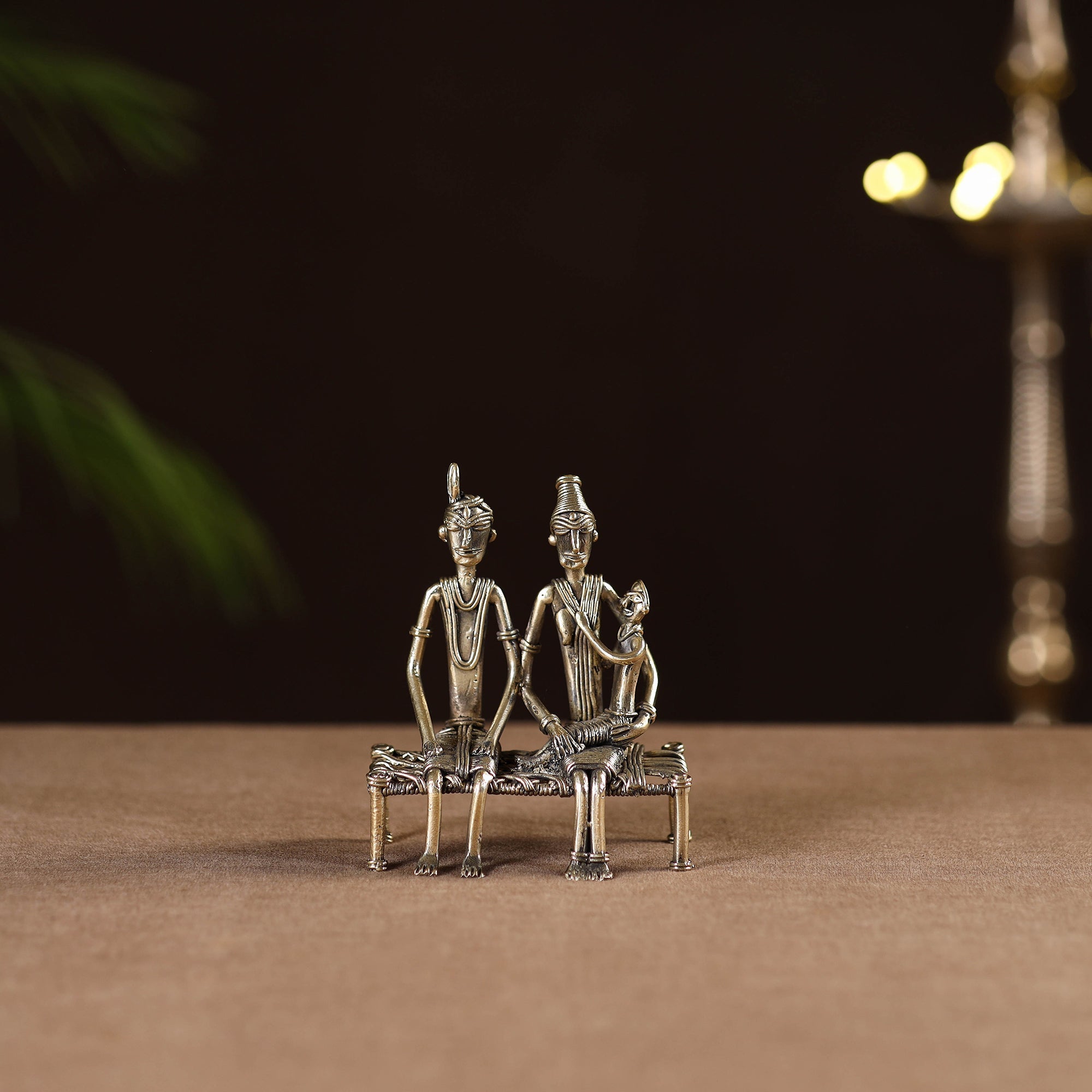 Couple child on cot - tribal odisha dokra handmade home