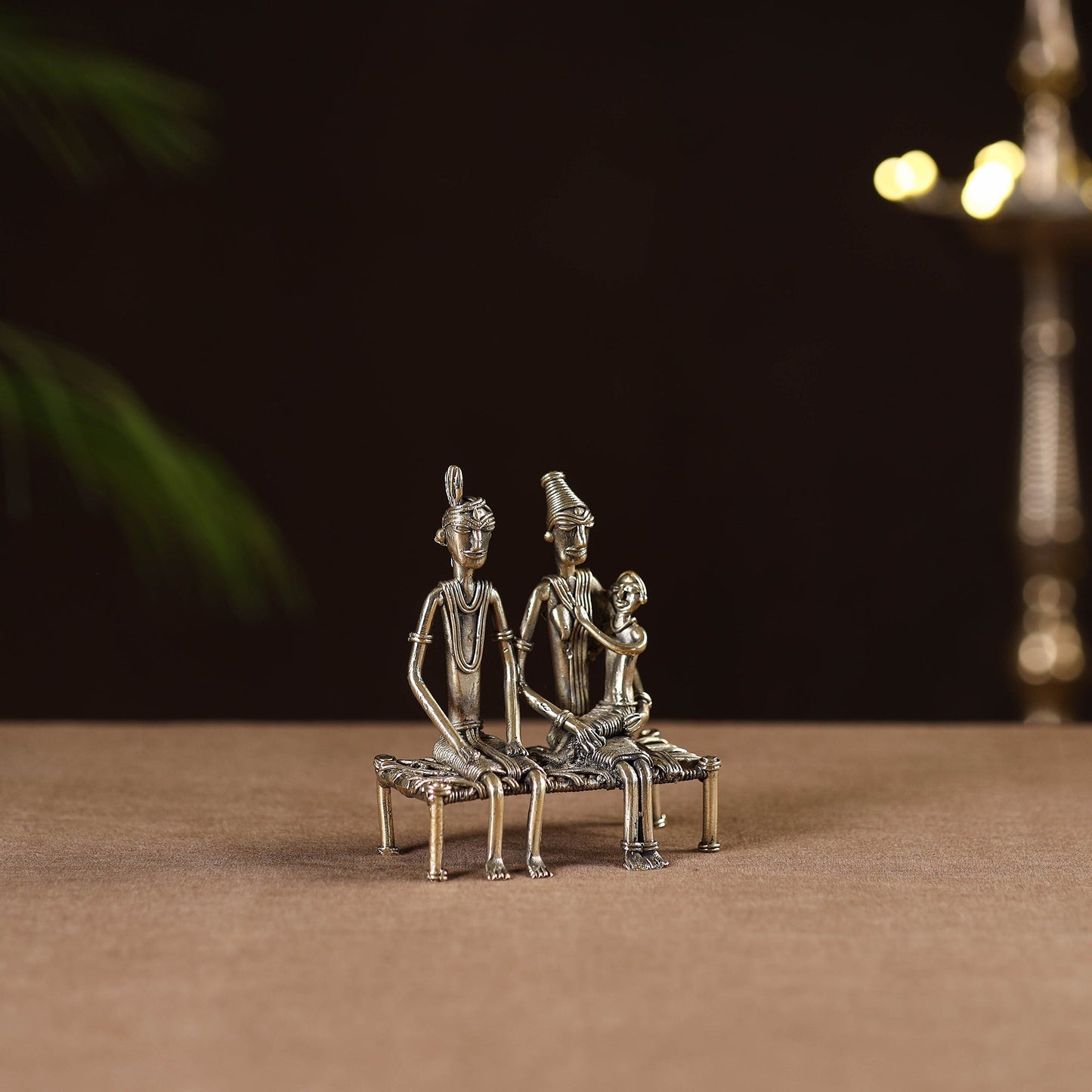 Couple child on cot - tribal odisha dokra handmade home