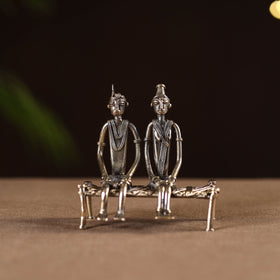 Couple sitting on cot - tribal odisha dokra handmade home