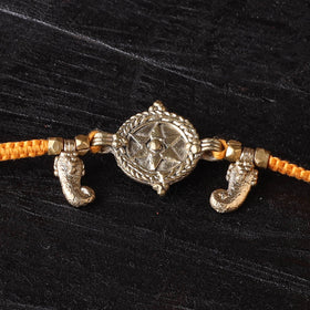 Handcrafted tribal dokra brass thread rakhi 26