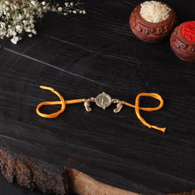 Handcrafted tribal dokra brass thread rakhi 26
