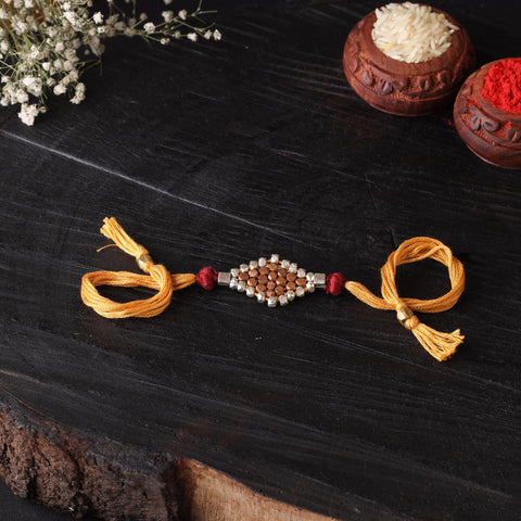 Handcrafted tribal dokra brass thread rakhi 32