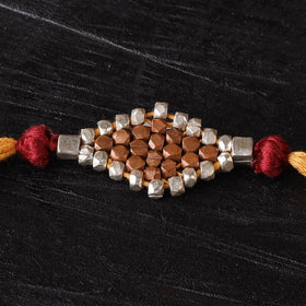 Handcrafted tribal dokra brass thread rakhi 32
