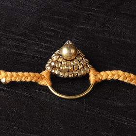 Handcrafted tribal dokra brass thread rakhi 54