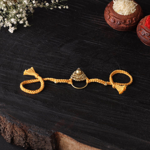 Handcrafted tribal dokra brass thread rakhi 54