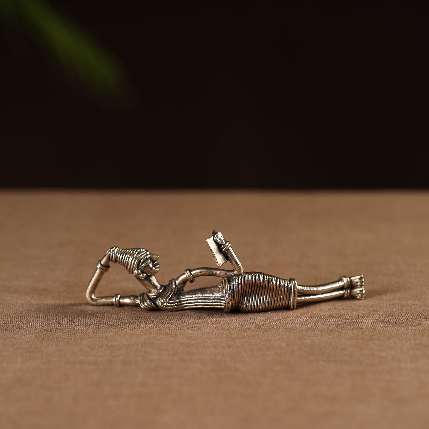 Side sleeping lady with book - tribal odisha dokra handmade