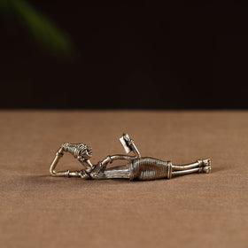 Side sleeping lady with book - tribal odisha dokra handmade