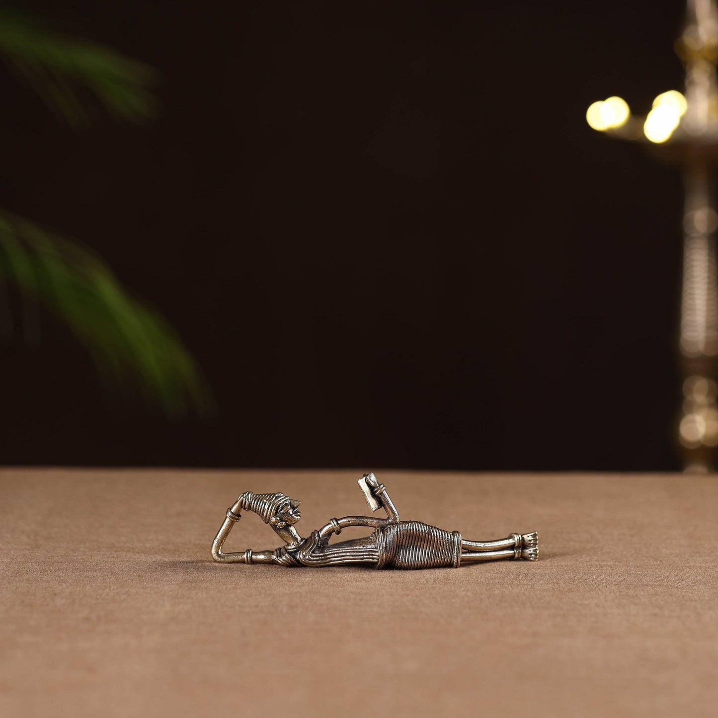 Side sleeping lady with book - tribal odisha dokra handmade