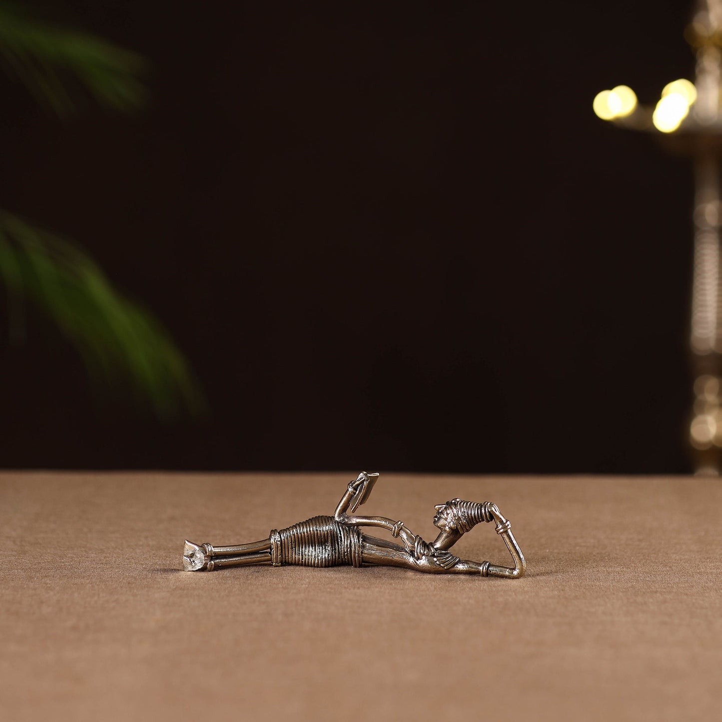 Side sleeping lady with book - tribal odisha dokra handmade