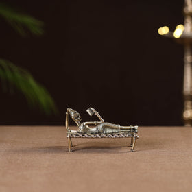 Sleeping reading women on cot - tribal odisha dokra