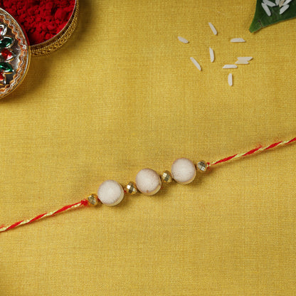 3 Buttons - Bamboo Craft Beadwork Rakhi by Baansuli